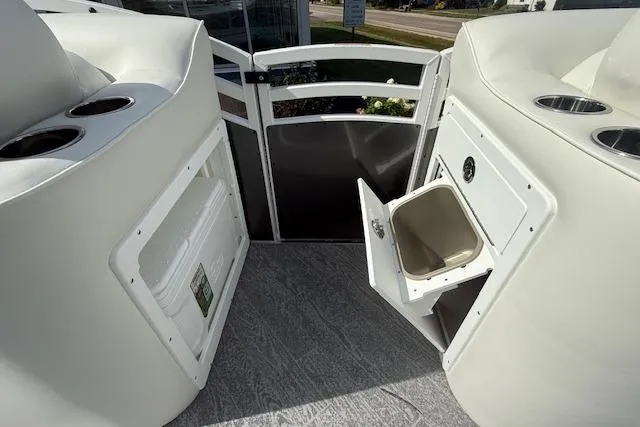 Slide: The Image of 2023 JC Neptoon 23 TT Sport boat interior with storage compartments and cup holders. - 15