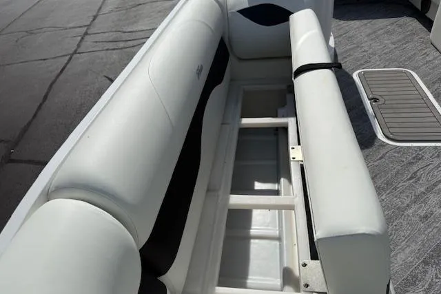 Slide: The Image of 2023 JC Neptoon 23 TT Sport boat interior with open storage compartment. - 19