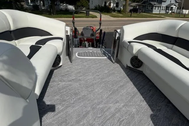 Slide: The Image of 2023 JC Neptoon 23 TT Sport pontoon boat interior with plush seating and modern design. - 23