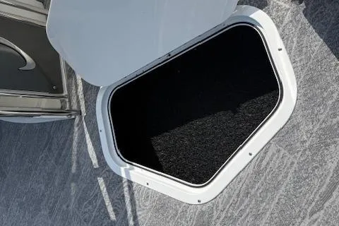 Slide: The Image of 2023 JC Neptoon 23 TT Sport boat storage compartment with open hatch. - 24