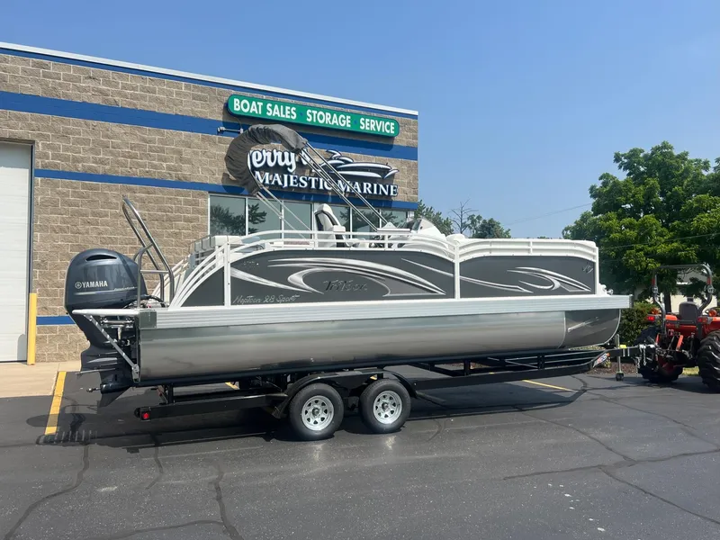 Slide: The Image of 2023 JC Neptoon 23 TT Sport pontoon boat on trailer at boat dealership. - 4