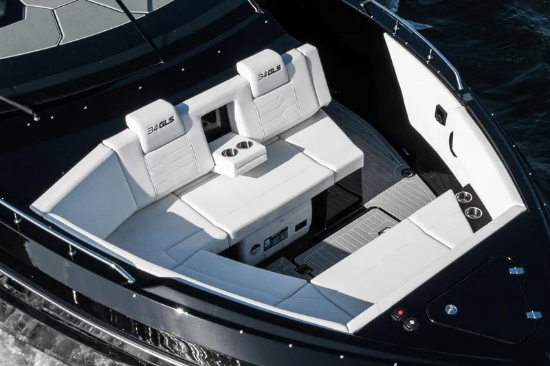 Slide: The Image of 2025 Cruisers Yachts 34 GLS with luxurious white seating and sleek design. - 11