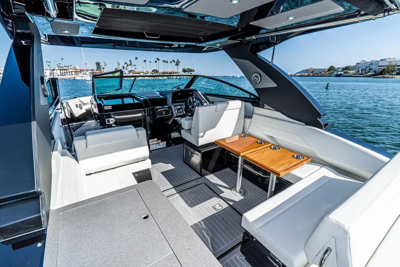 Slide: The Image of Luxurious 2025 Cruisers Yachts 34 GLS interior with elegant seating and scenic ocean view. - 17