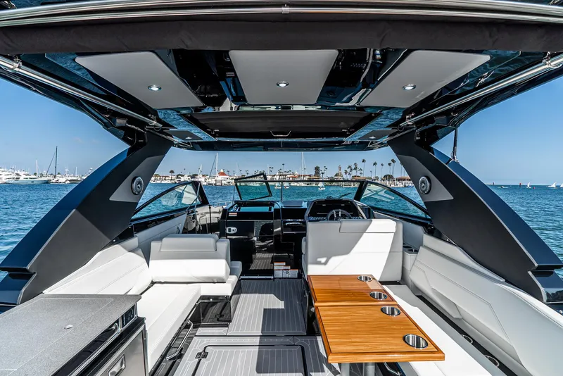Slide: The Image of 2025 Cruisers Yachts 34 GLS interior with luxurious seating and ocean view. - 20