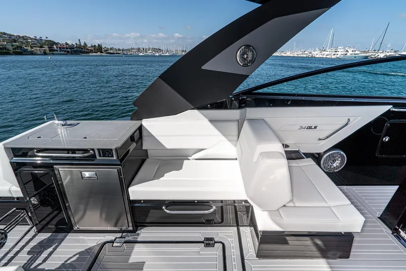 Slide: The Image of 2025 Cruisers Yachts 34 GLS luxury seating area with ocean view. - 21
