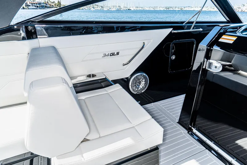 Slide: The Image of 2025 Cruisers Yachts 34 GLS interior with sleek white seating and modern design. - 25