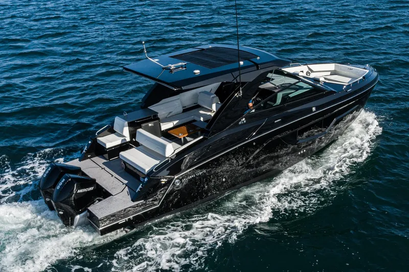 Slide: The Image of 2025 Cruisers Yachts 34 GLS luxury boat cruising on open water. - 7