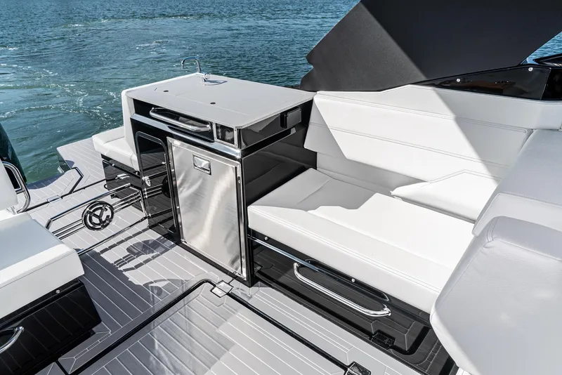 Slide: The Image of Luxurious 2025 Cruisers Yachts 34 GLS interior with sleek seating and modern amenities. - 22