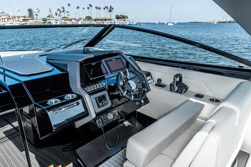Slide: The Image of 2025 Cruisers Yachts 34 GLS cockpit with modern controls and ocean view. - 27