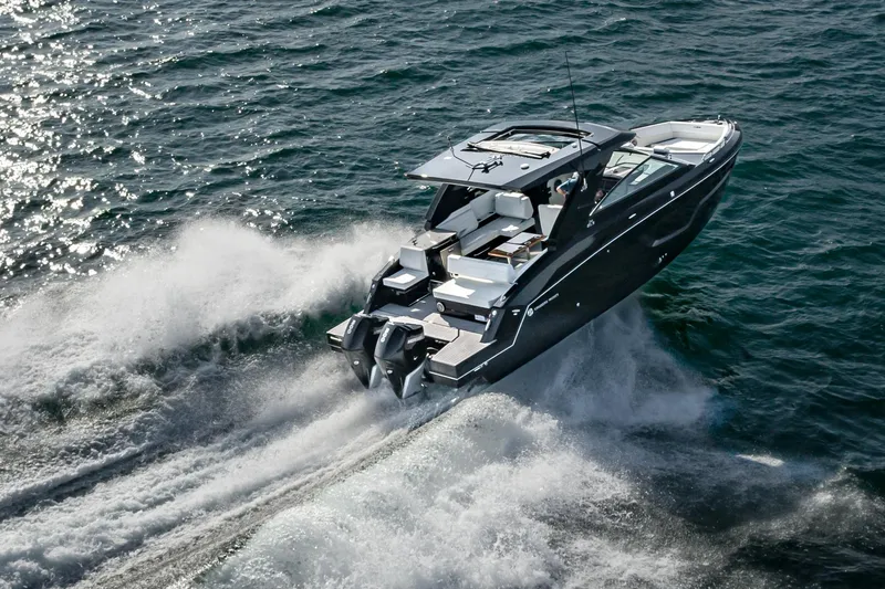 Slide: The Image of 2025 Cruisers Yachts 34 GLS speeding on open water. - 3