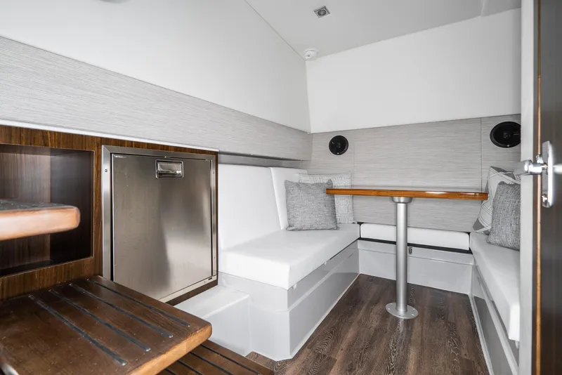 Slide: The Image of Interior of 2025 Cruisers Yachts 34 GLS, featuring modern seating and sleek design. - 34