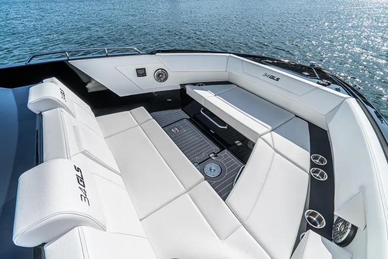 Slide: The Image of 2025 Cruisers Yachts 34 GLS luxury boat interior with white seating on water. - 9