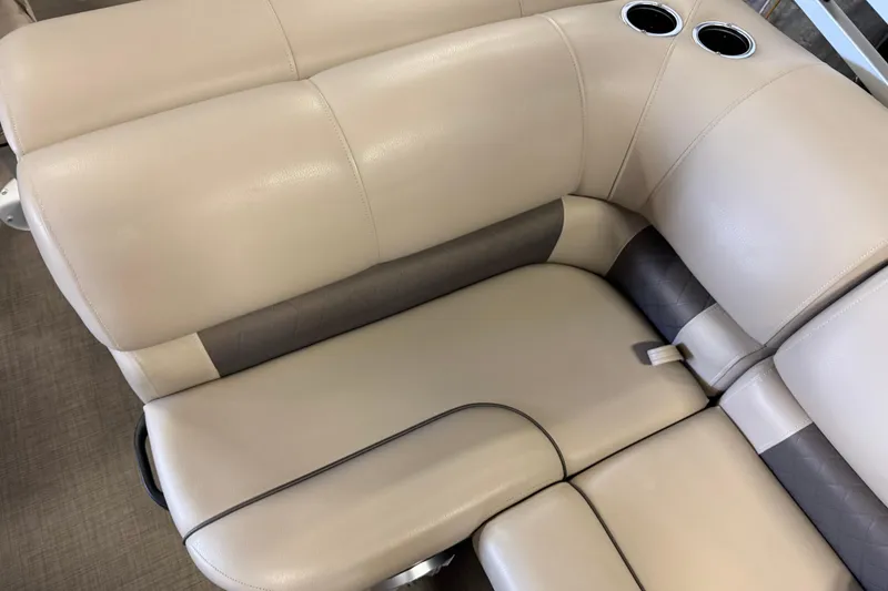 Slide: The Image of 2023 Sun Tracker SportFish 22 XP3 boat seating with cup holders, beige upholstery. - 10