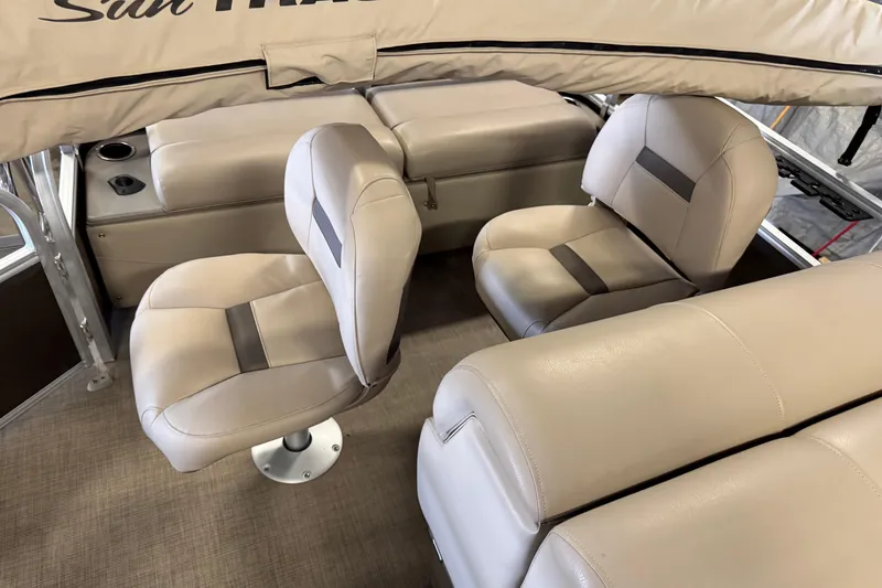 Slide: The Image of 2023 Sun Tracker SportFish 22 XP3 interior with beige seating and cup holders. - 13