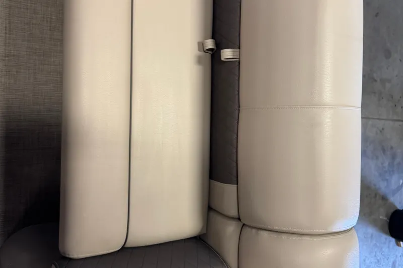 Slide: The Image of 2023 Sun Tracker SportFish 22 XP3 boat seat upholstery, beige and gray tones. - 7