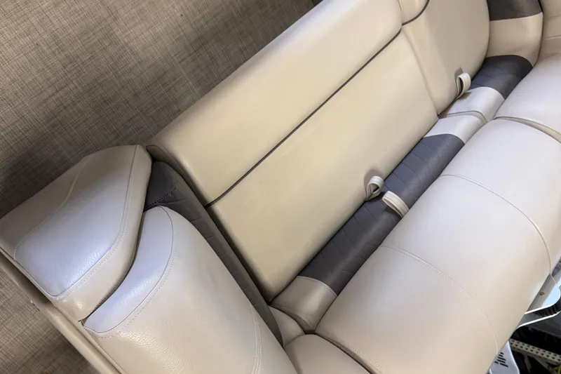 Slide: The Image of 2023 Sun Tracker SportFish 22 XP3 boat seating, featuring beige and gray upholstery. - 9