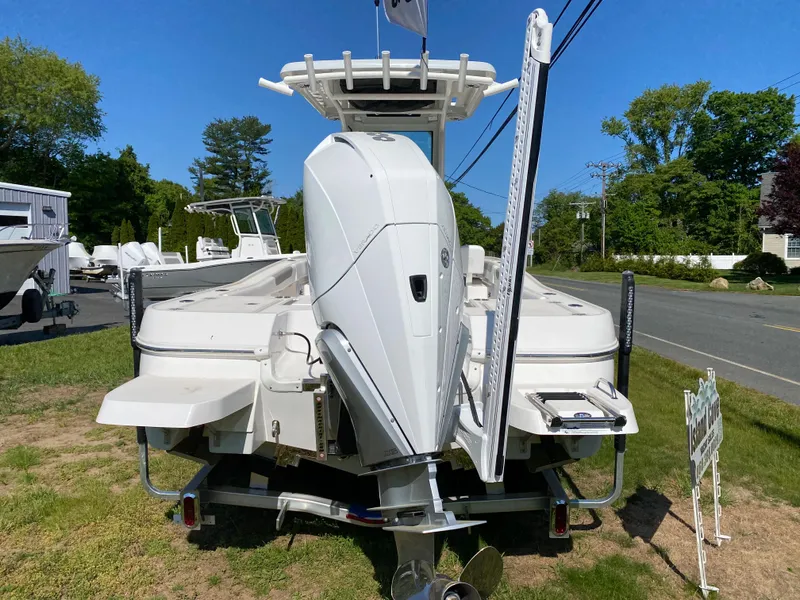 Slide: The Image of 2023 Caymas 26 HB boat with outboard motor, rear view. - 10