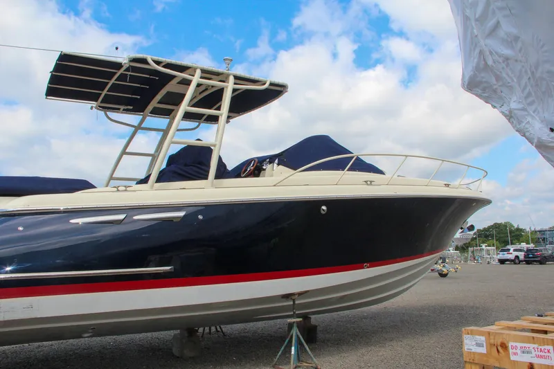 Slide: The Image of 2017 Chris-Craft Launch 36 boat on dry dock under a blue sky. - 10