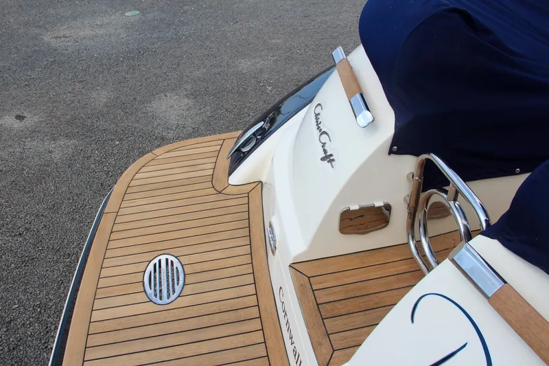 Slide: The Image of 2017 Chris-Craft Launch 36 boat with teak deck and covered seating area. - 17