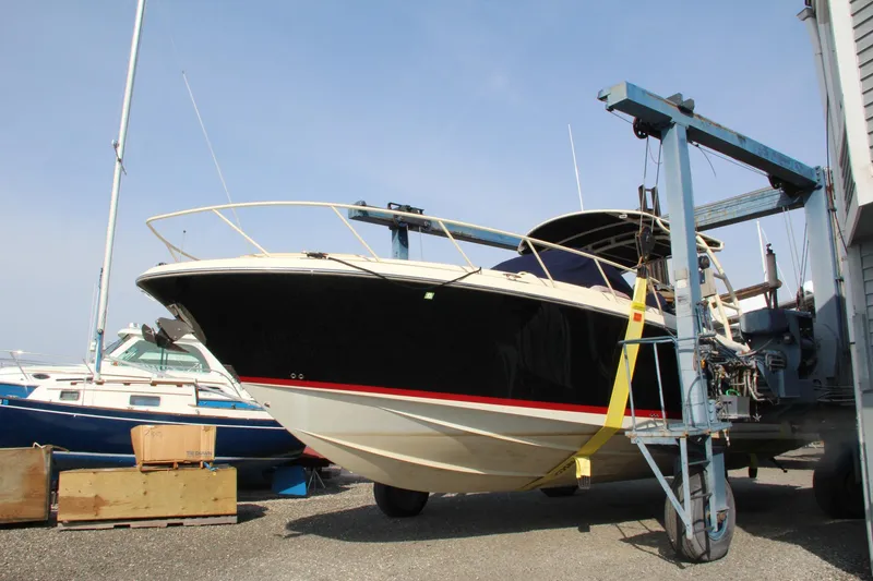 Slide: The Image of 2017 Chris-Craft Launch 36 boat on a lift in a marina. - 2