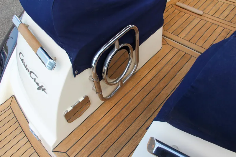 Slide: The Image of 2017 Chris-Craft Launch 36 boat with teak deck and navy blue covers. - 20