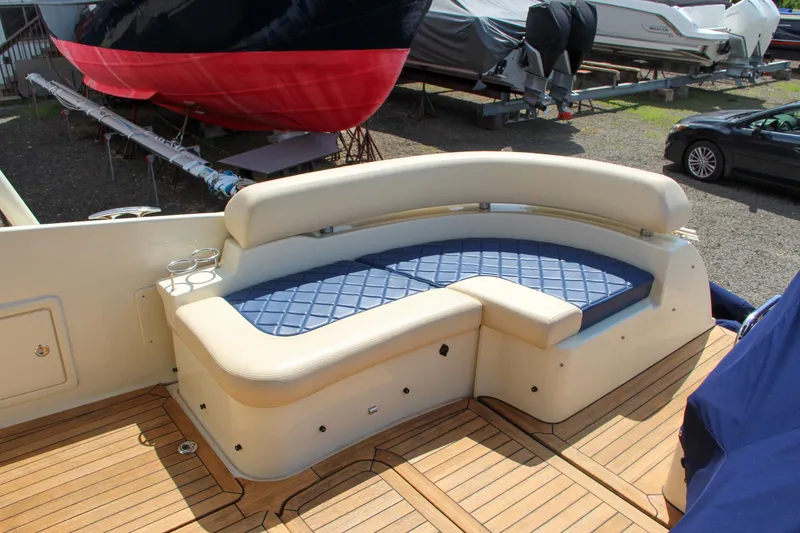 Slide: The Image of 2017 Chris-Craft Launch 36 boat with cushioned seating area on deck. - 23