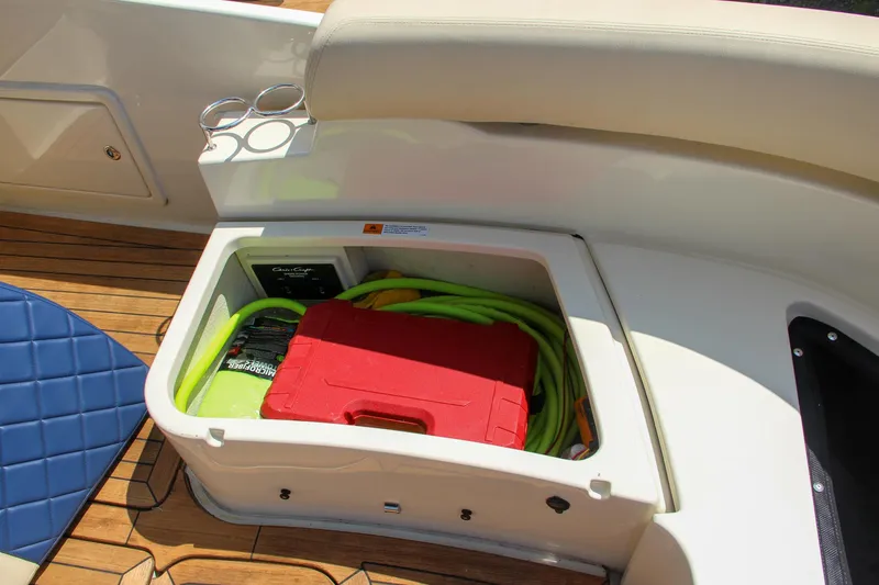 Slide: The Image of 2017 Chris-Craft Launch 36 storage compartment with tools and hose. - 27