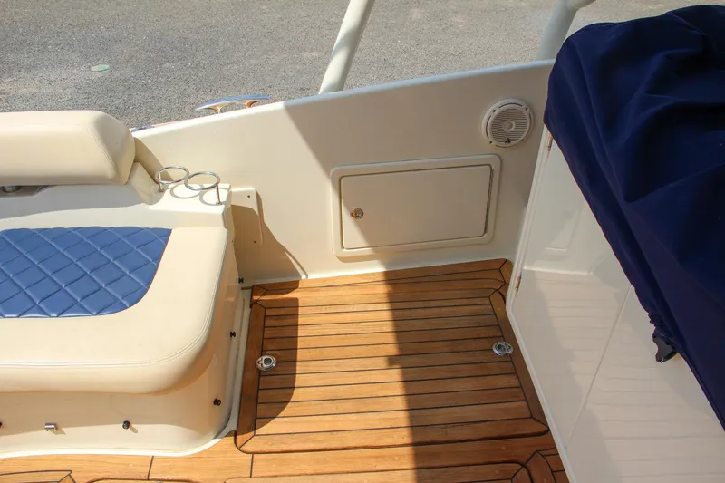 Slide: The Image of 2017 Chris-Craft Launch 36 boat interior with teak flooring and cushioned seating. - 38