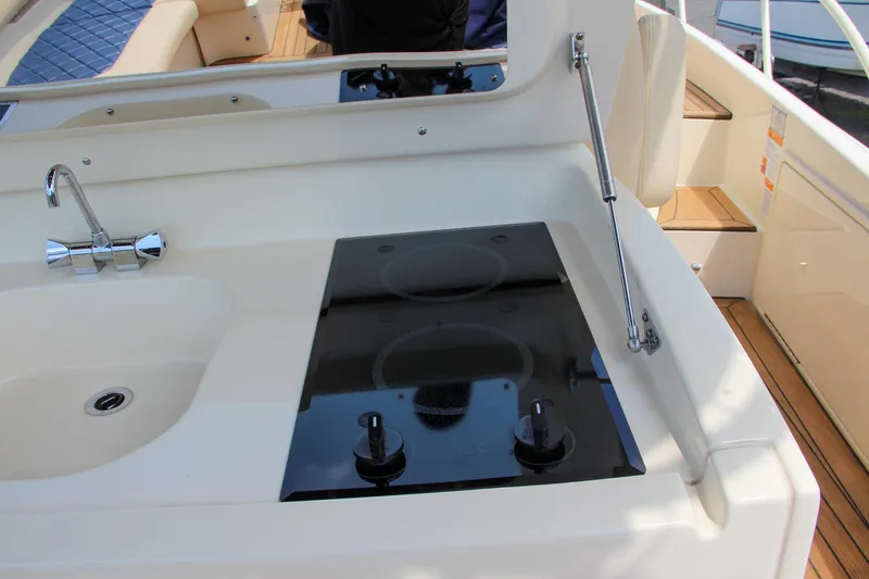 Slide: The Image of 2017 Chris-Craft Launch 36 boat kitchen with sink and stovetop. - 46