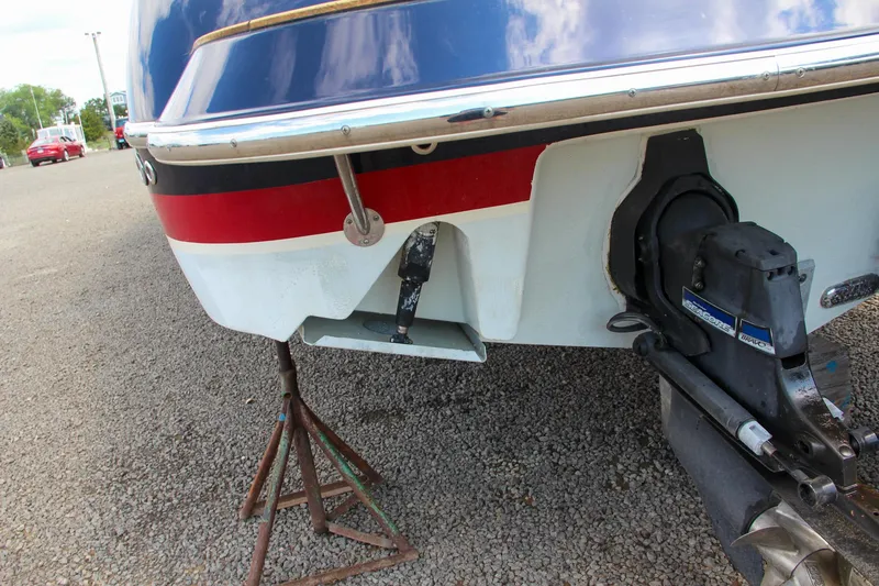 Slide: The Image of 2017 Chris-Craft Launch 36 boat stern with outboard motor on a stand. - 7