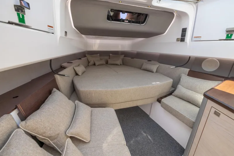 Slide: The Image of 2024 Axopar 45 interior cabin with spacious seating and modern design. - 7