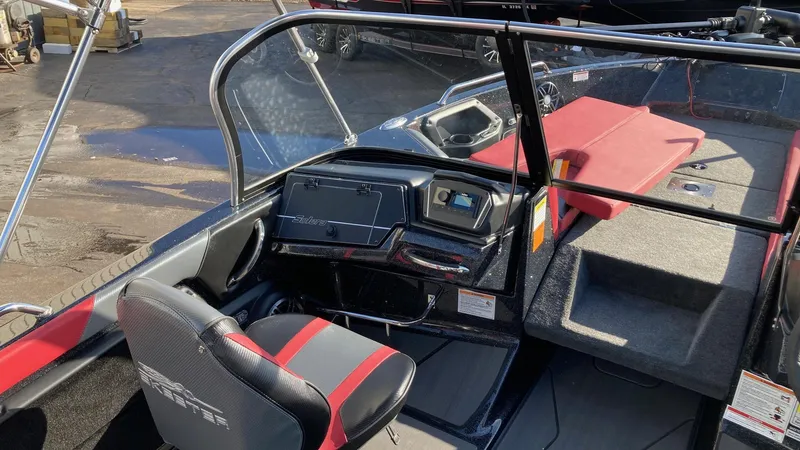 Slide: The Image of 2024 Skeeter Solera 205 boat interior with steering console and seating. - 4