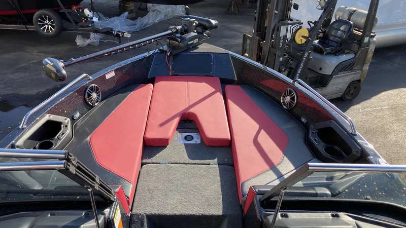 Slide: The Image of 2024 Skeeter Solera 205 boat interior with red seating and fishing equipment. - 5