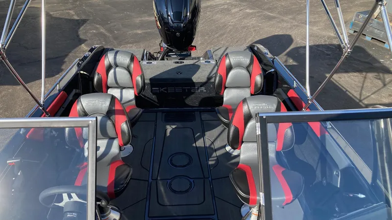 Slide: The Image of 2024 Skeeter Solera 205 boat interior with black and red seating. - 6