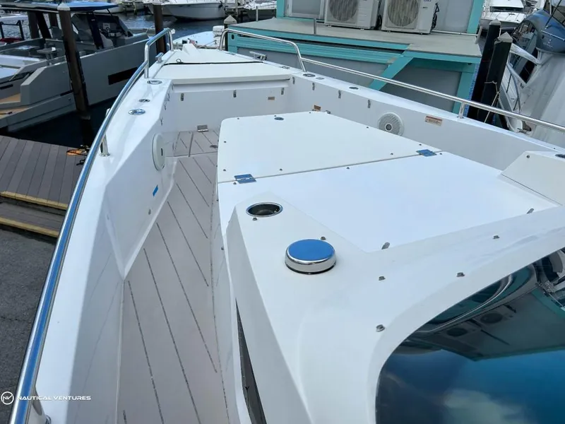 Slide: The Image of 2018 Axopar 37 Sun Top boat deck at marina. - 11