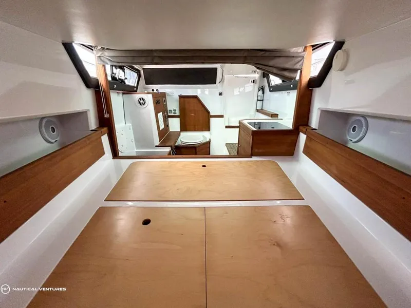 Slide: The Image of Interior cabin of 2018 Axopar 37 Sun Top boat with wooden finishes. - 21