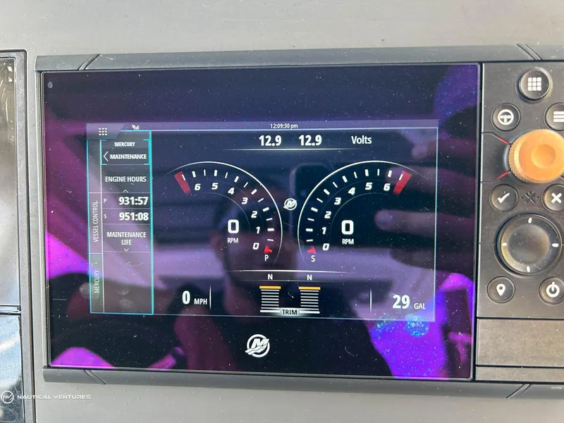 Slide: The Image of Dashboard display of a 2018 Axopar 37 Sun Top showing engine hours and fuel levels. - 24