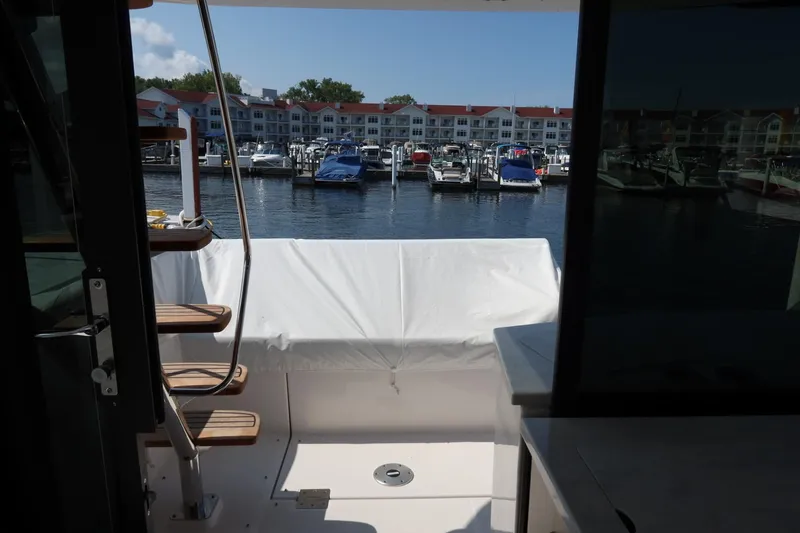 Slide: The Image of 2024 Regal 38 Fly yacht interior with marina view. - 10