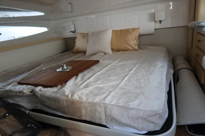 Slide: The Image of Luxurious cabin interior of 2024 Regal 38 Fly yacht with elegant bedding. - 18