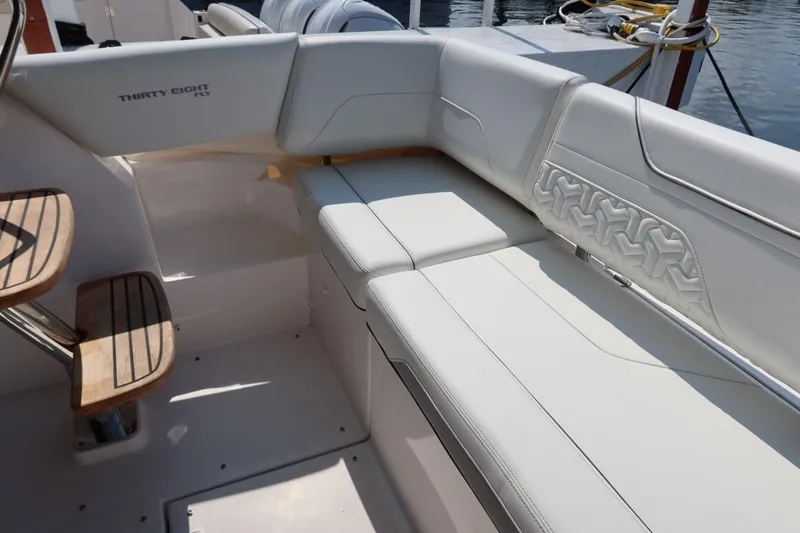 Slide: The Image of Luxurious seating on 2024 Regal 38 Fly yacht, featuring elegant white upholstery. - 21