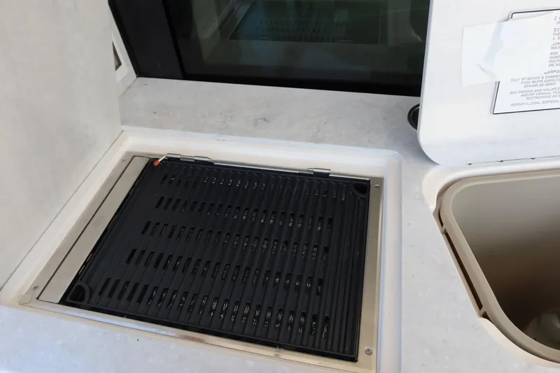 Slide: The Image of Built-in grill on 2024 Regal 38 Fly yacht deck. - 5