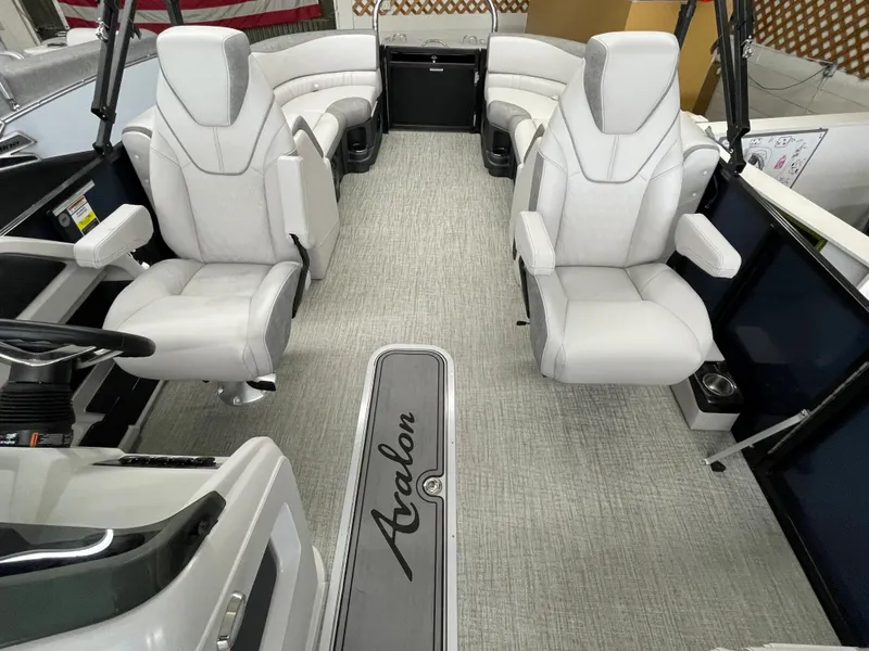 Slide: The Image of 2024 Avalon 2385 LSZ QL boat interior with luxurious white seating and modern design. - 2