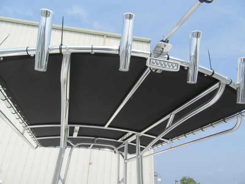 Slide: The Image of 2024 Parker 2100 Special Edition boat T-top with rod holders and LED light. - 10