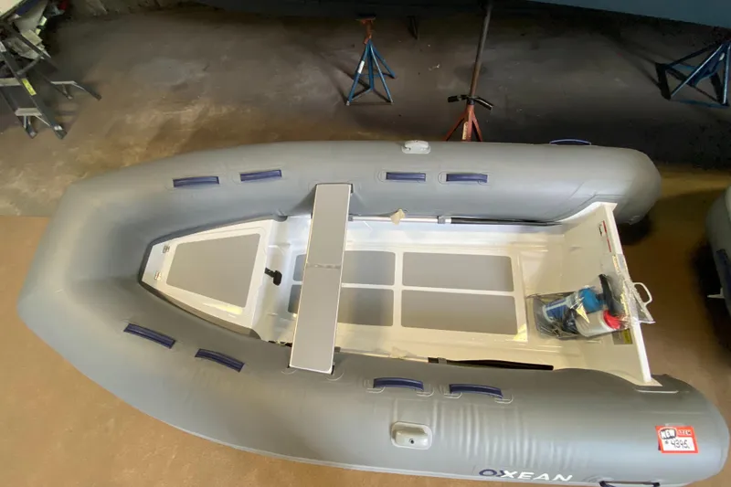 The Image of 2023 AB Inflatables Oxxean 320 AL inflatable boat in a garage. - 1