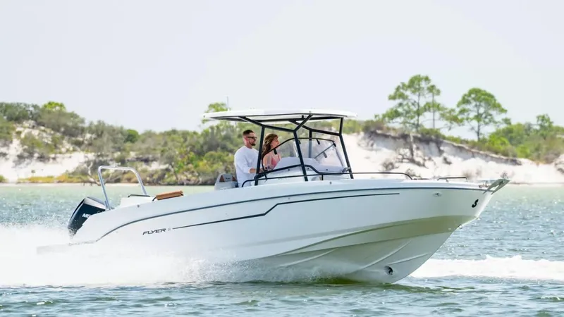 Slide: The Image of 2024 Beneteau Flyer 8 SPACEdeck cruising on a scenic waterway. - 2