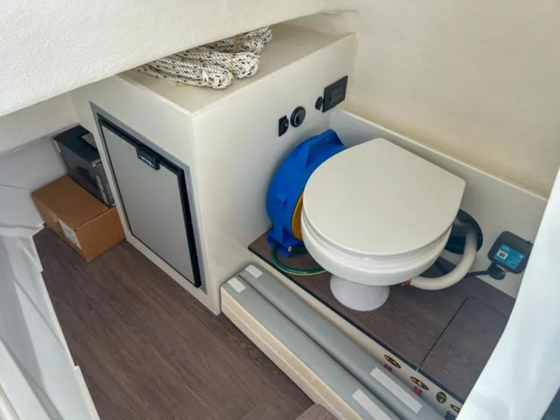 Slide: The Image of 2024 Beneteau Flyer 8 SPACEdeck interior with compact toilet and storage. - 7