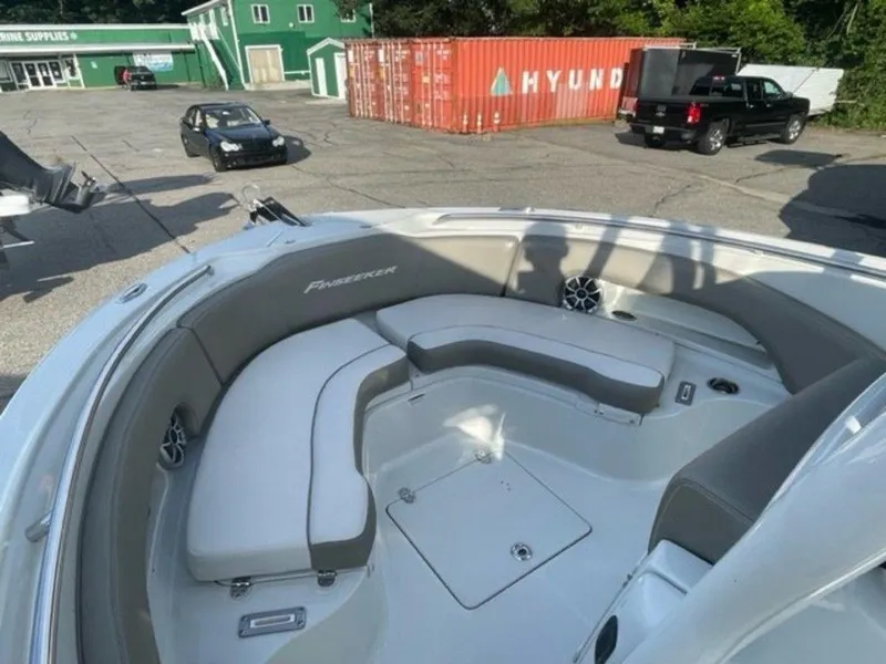 Slide: The Image of 2024 Finseeker 210 FS boat with spacious seating and storage compartments. - 10