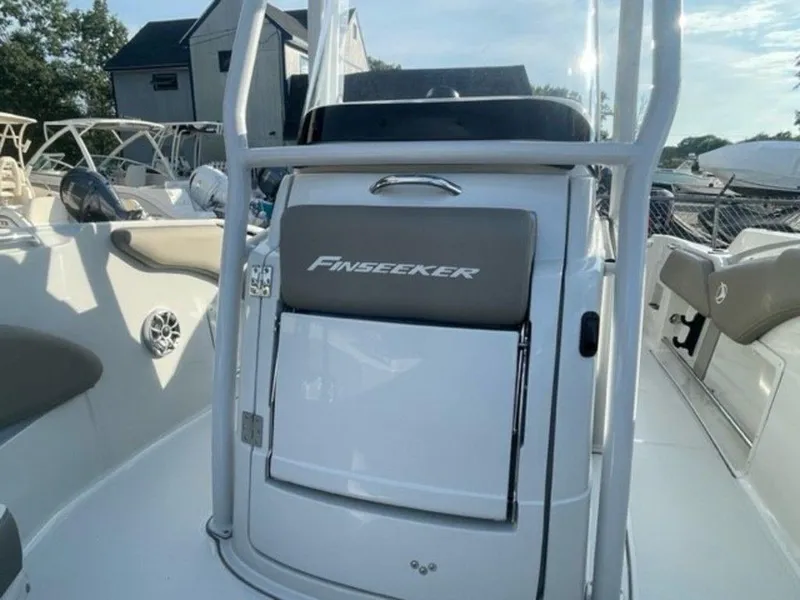 Slide: The Image of 2024 Finseeker 210 FS boat console with storage compartment and seating. - 11