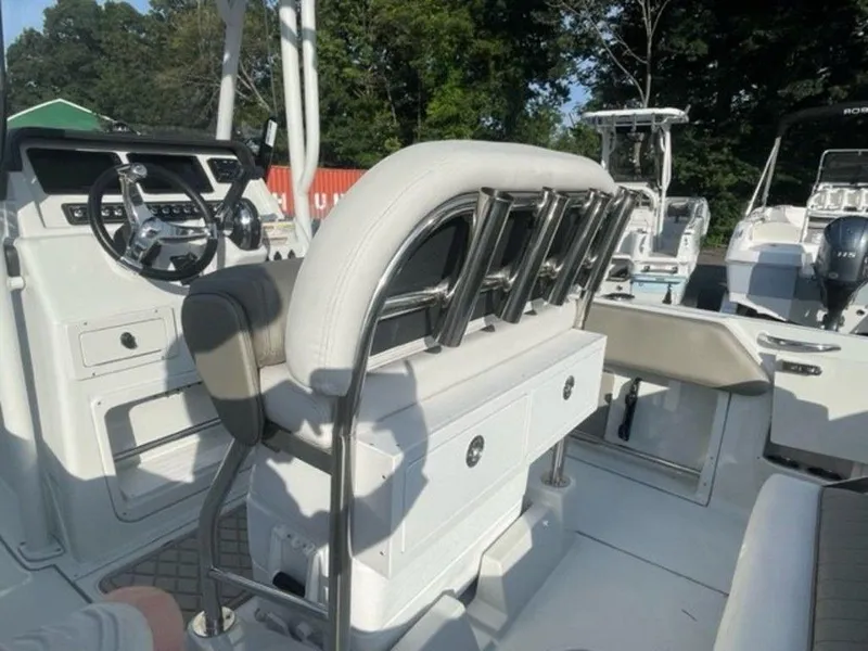 Slide: The Image of 2024 Finseeker 210 FS boat interior with steering console and seating. - 12