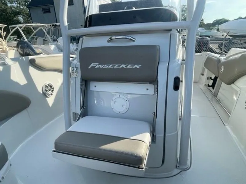 Slide: The Image of 2024 Finseeker 210 FS boat interior with seating and console. - 13